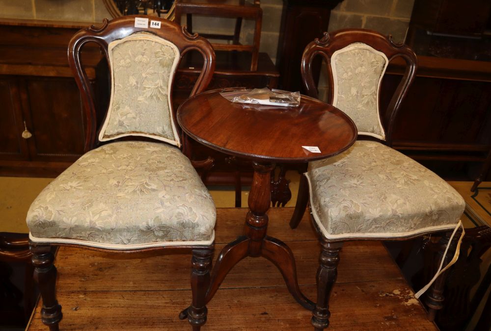 A 19th century mahogany tripod wine table, 50cm diameter and a pair of Victorian mahogany dining chairs